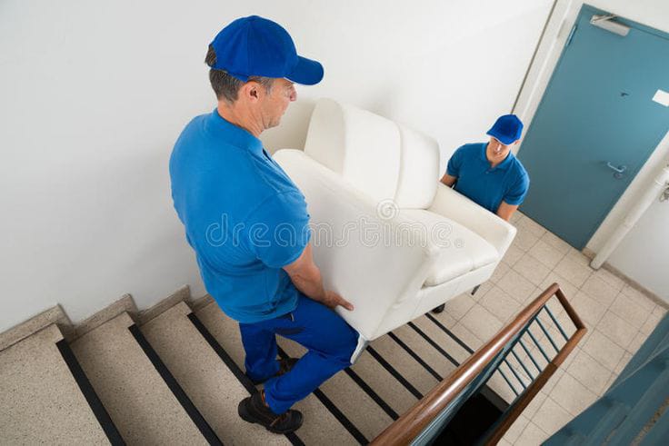 Licensed moving team loading truck in Bur Dubai residential area