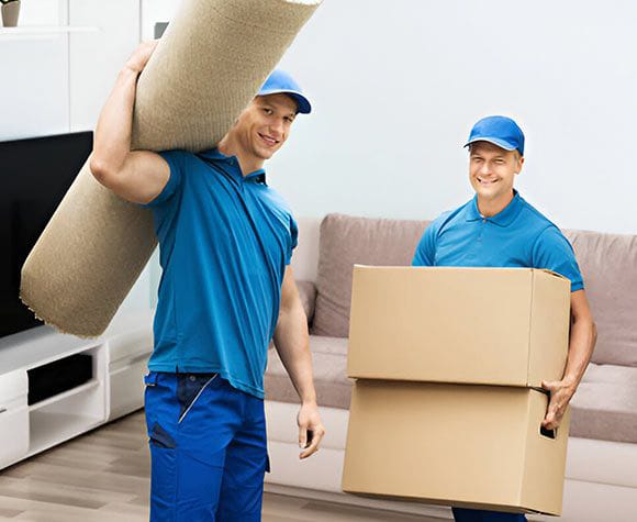 Professional packers wrapping furniture in Dubai Marina tower